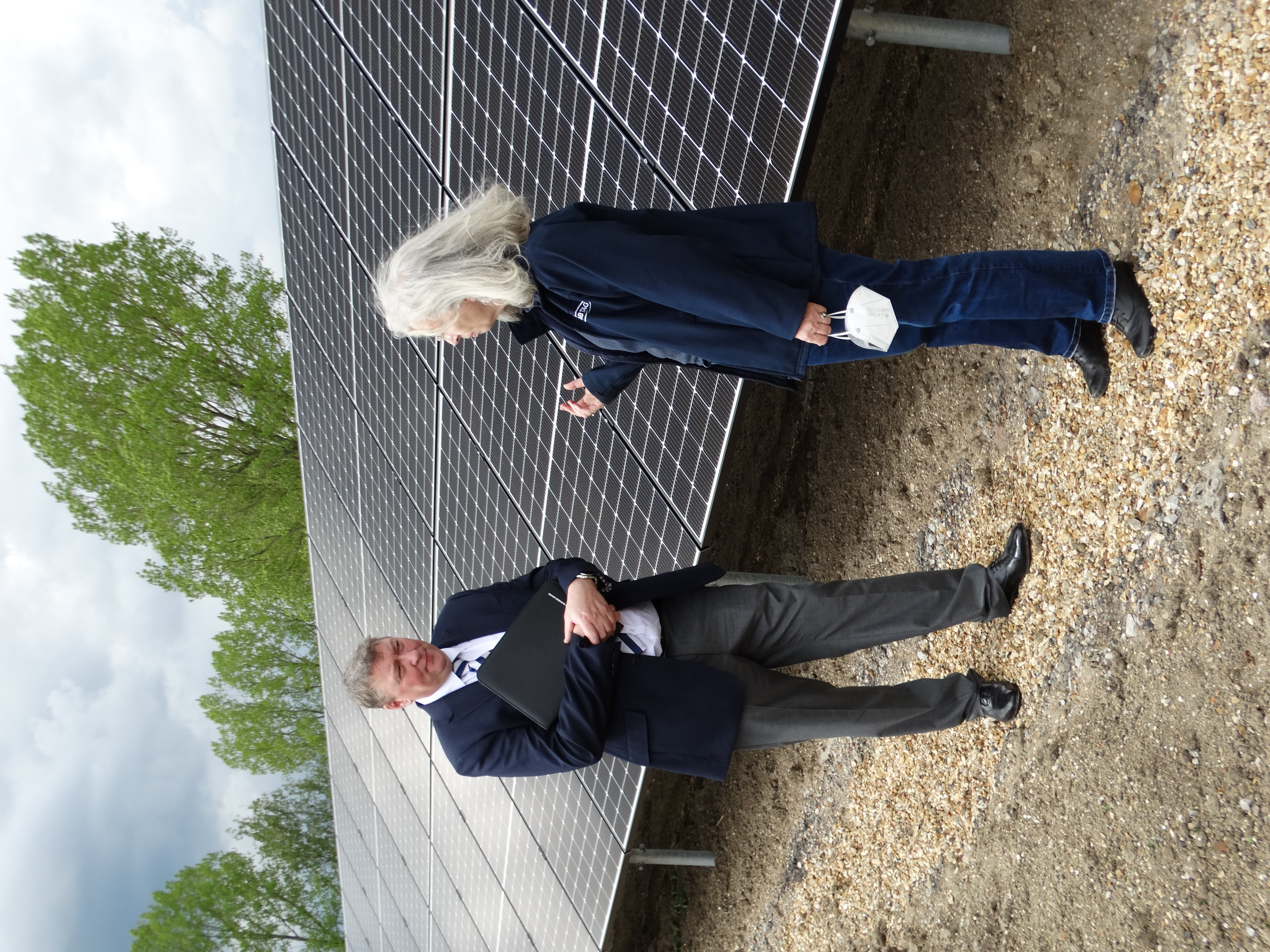 NIAB’s Dr Lydia Smith and Austen Adams, chair of the Cambridgeshire and Peterborough Combined Authority Business Board, inspect the new 33KW solar farm at the Eastern AgriTech Innovation Hub