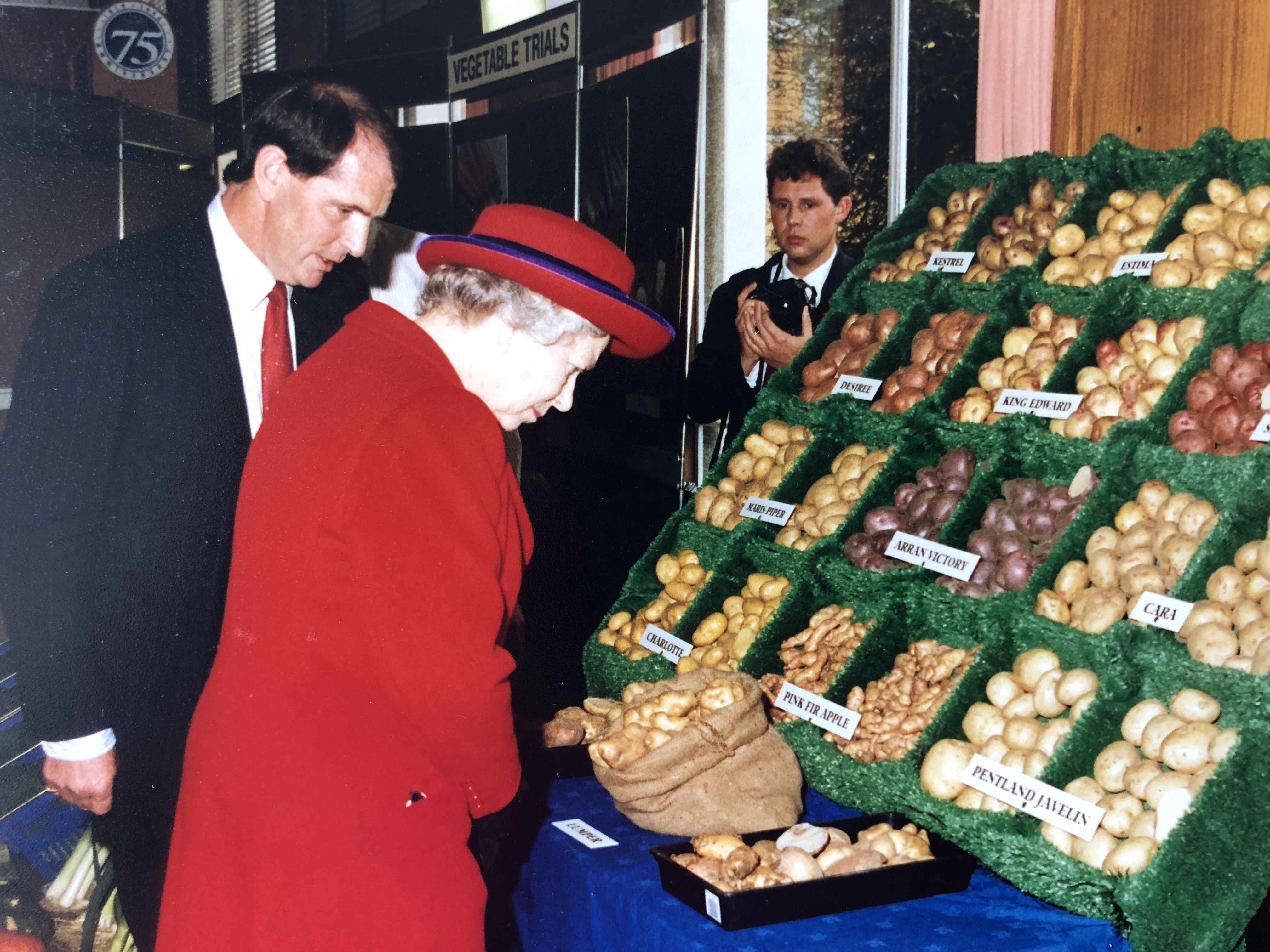The Queen inspects some potatoes during the 1994 royal visit to NIAB