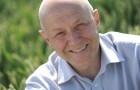 Professor Andy Greenland in a field on wheat at NIAB