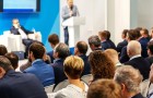 People listening to a speaker at a conference