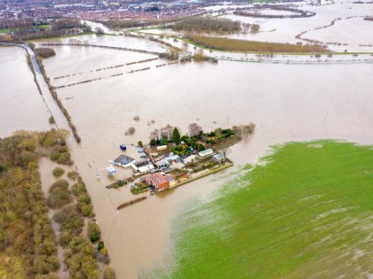 Flooded fields and farm house from the River Aire during a large flood after a storm.