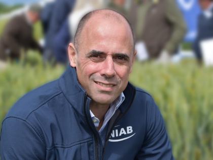 Professor Mario Caccamo in front of a wheat field