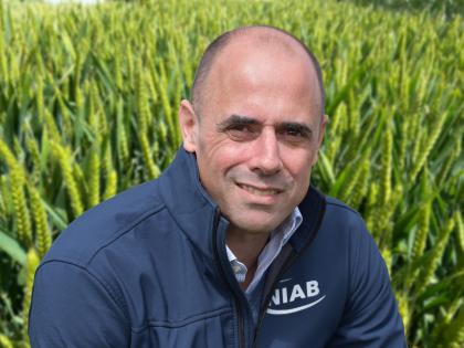 Professor Mario Caccamo in front of a wheat field