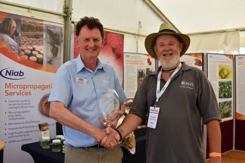 Niab's Scott Raffle receiving the George Lockie award from RHS' Gerry Edwards 